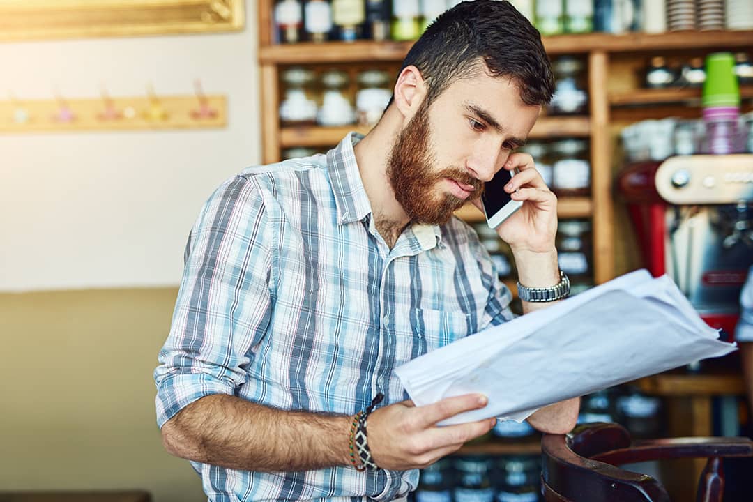 A store manager asking someone for a payment extension of their orders during a phone call.